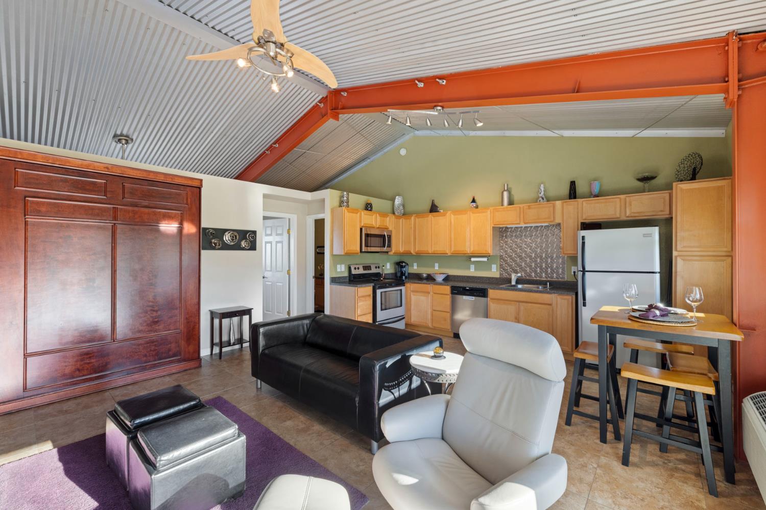 10675 Valensin Road Galt, CA 95632 - Photo 11 of 99 a living room with furniture a ceiling fan and a rug