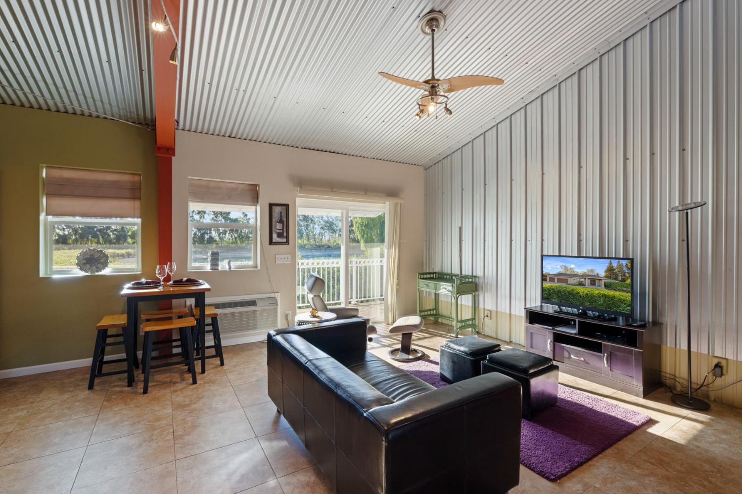 10675 Valensin Road Galt, CA 95632 - Photo 12 of 99 a living room with furniture and a flat screen tv