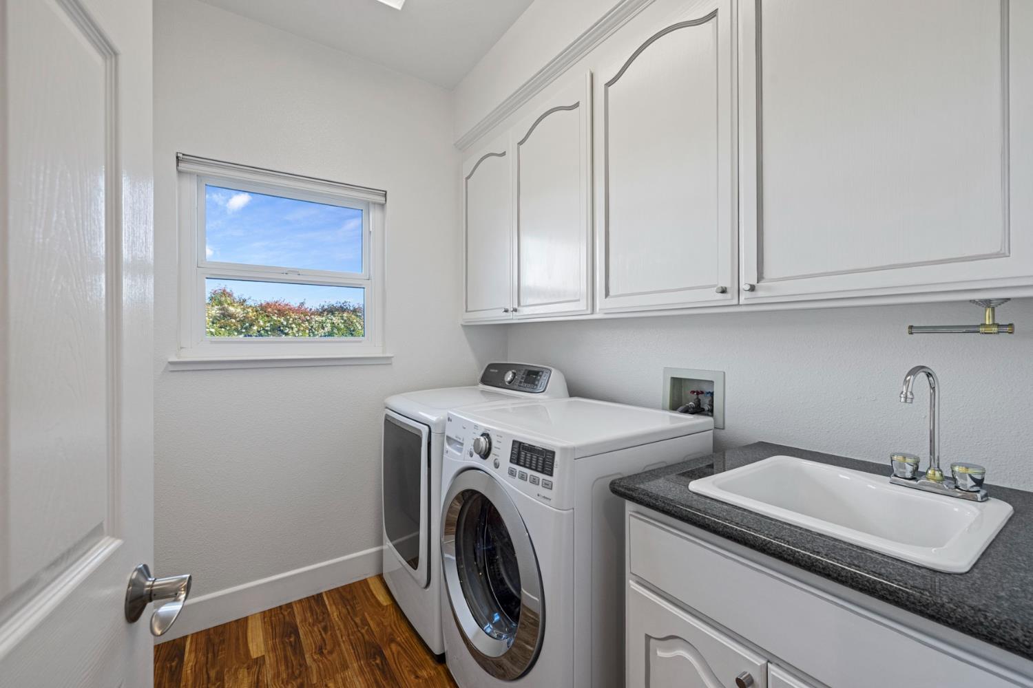 10675 Valensin Road Galt, CA 95632 - Photo 30 of 99 a view of a storage and utility room with washer and dryer