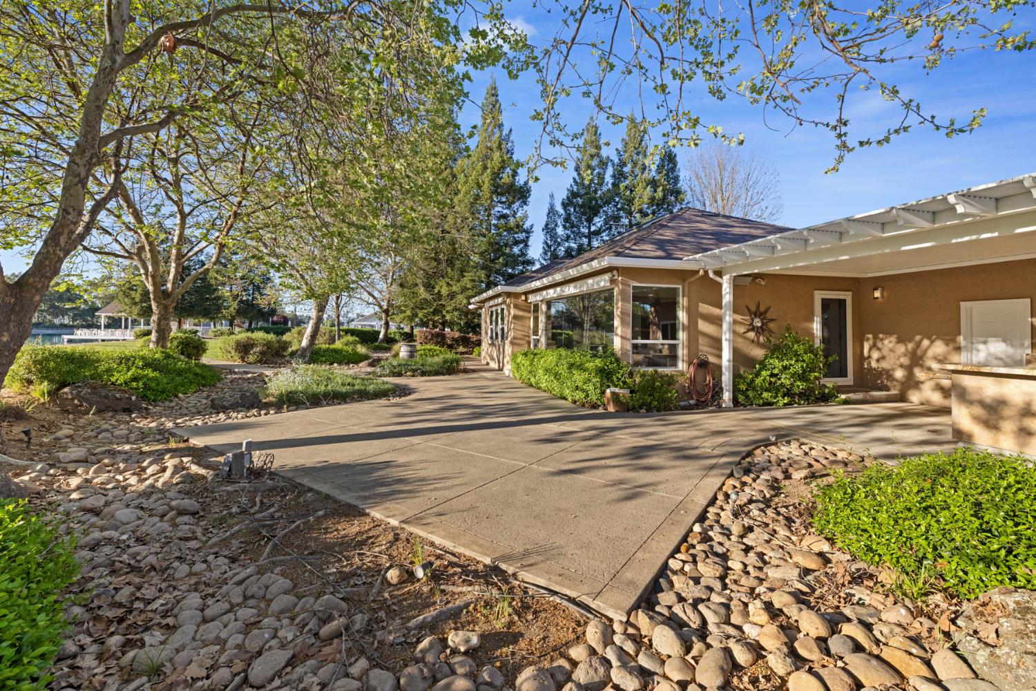 10675 Valensin Road Galt, CA 95632 - Photo 37 of 99 a view of a house with a yard and plants