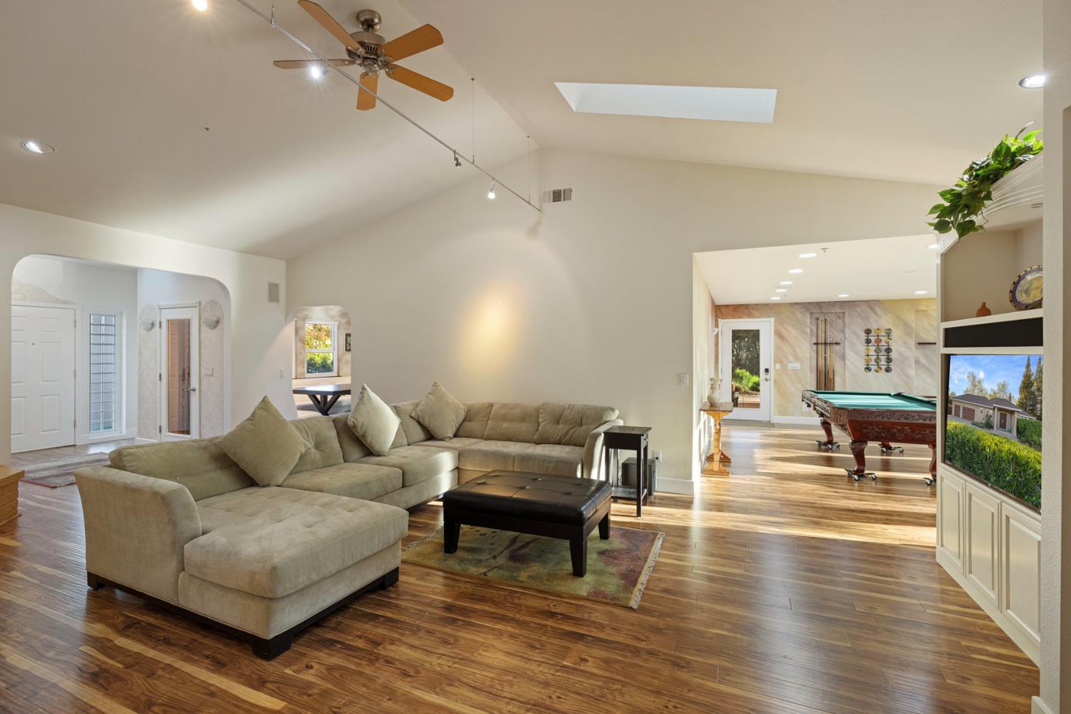 10675 Valensin Road Galt, CA 95632 - Photo 42 of 99 a living room with furniture and a wooden floor