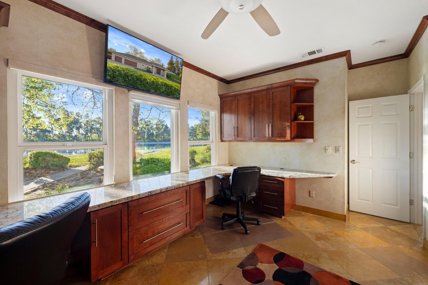10675 Valensin Road Galt, CA 95632 - Photo 53 of 99 a view of a workspace with furniture and a window
