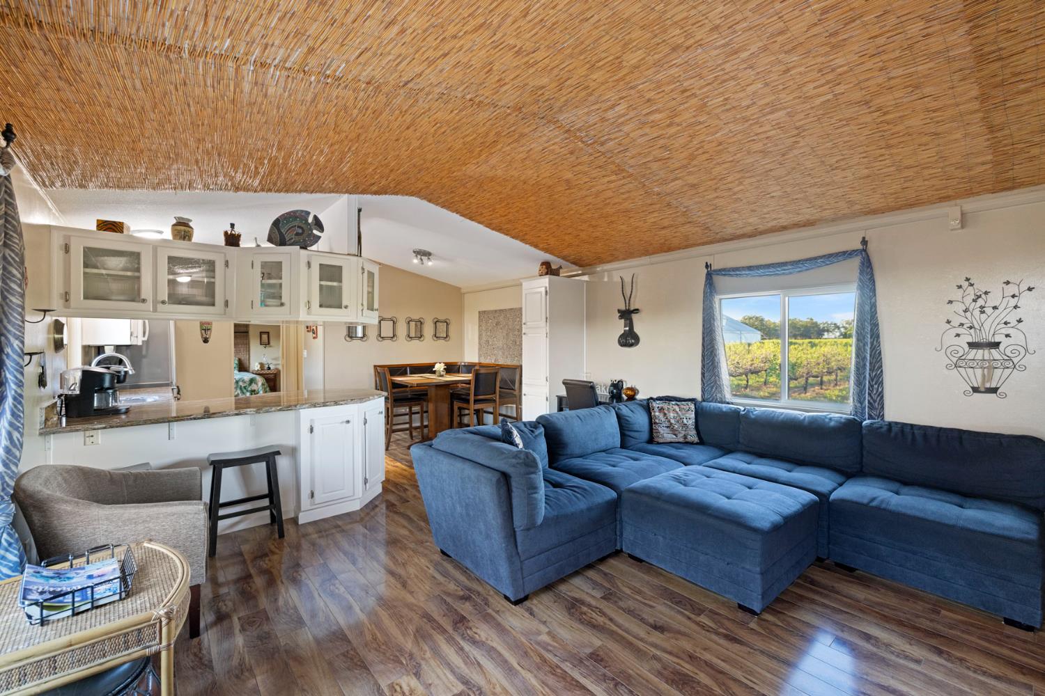 10675 Valensin Road Galt, CA 95632 - Photo 56 of 99 a living room with furniture and wooden floor