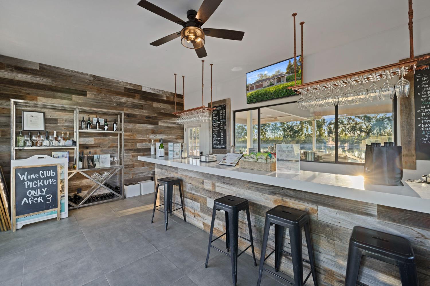 10675 Valensin Road Galt, CA 95632 - Photo 6 of 99 a kitchen with stainless steel appliances granite countertop a table chairs and a wooden floor