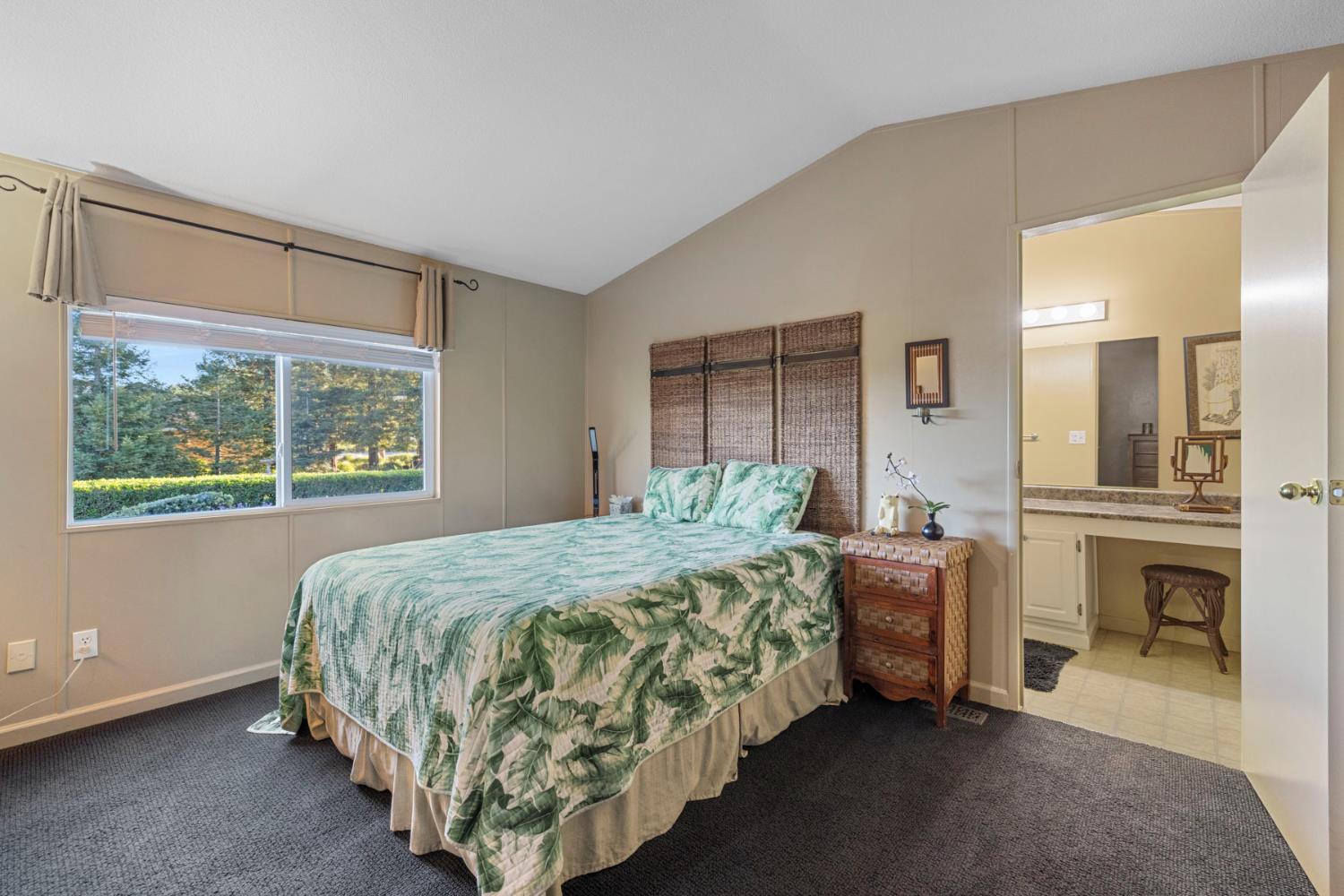 10675 Valensin Road Galt, CA 95632 - Photo 62 of 99 a bed sitting in a spacious bedroom next to a window