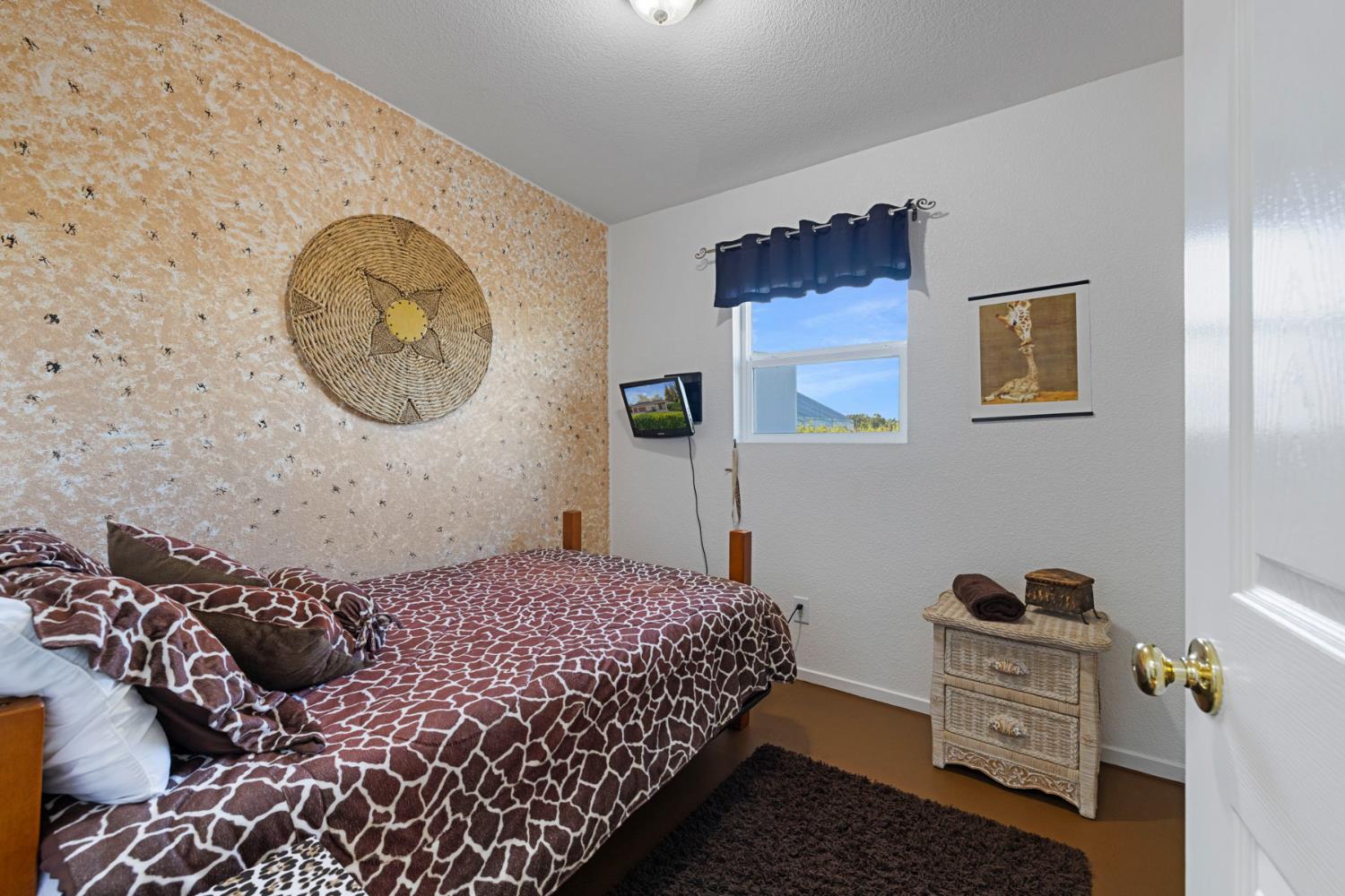 10675 Valensin Road Galt, CA 95632 - Photo 66 of 99 a bedroom with a bed and a painting on the wall