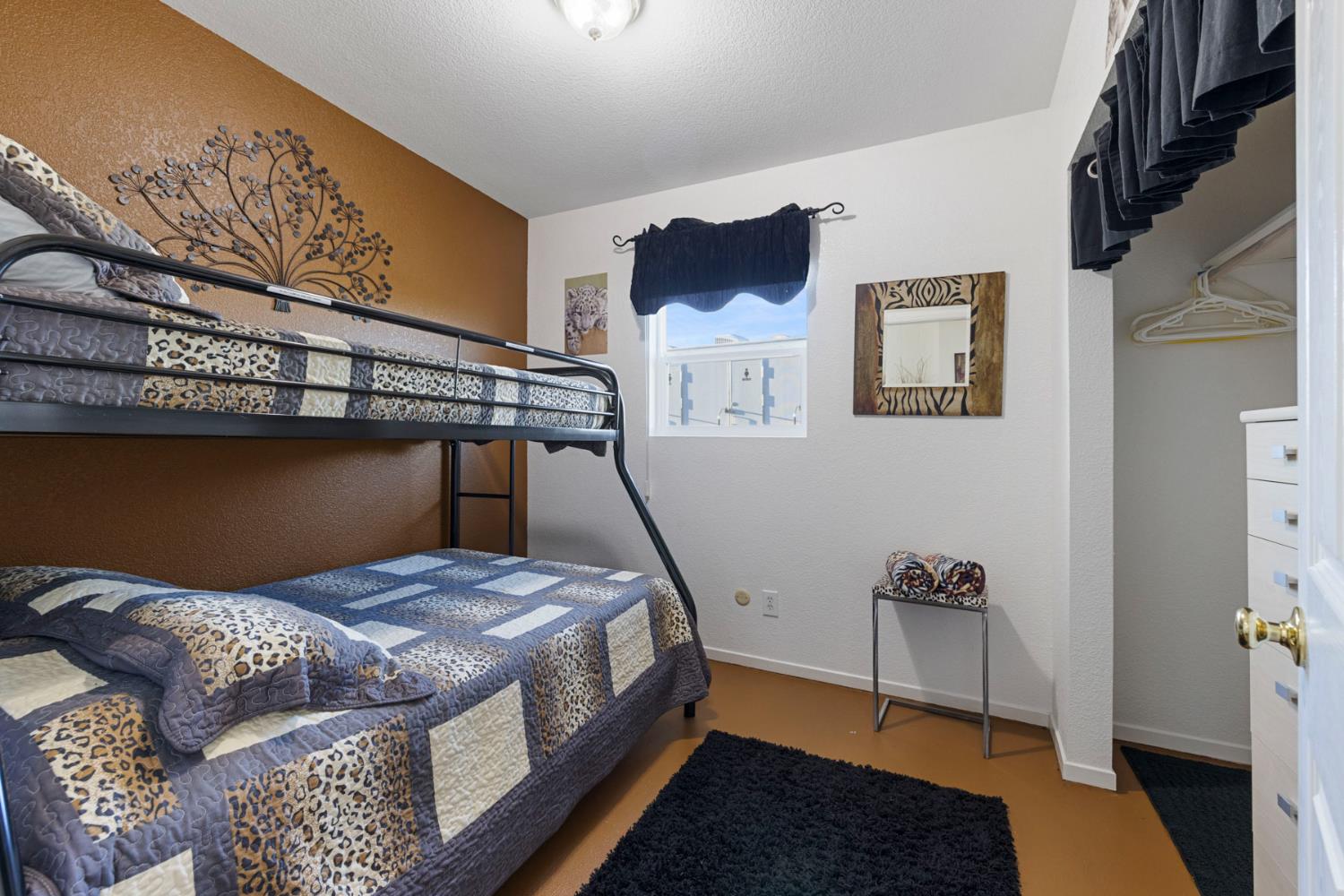 10675 Valensin Road Galt, CA 95632 - Photo 67 of 99 a bedroom with a bed and a potted plant on the dresser