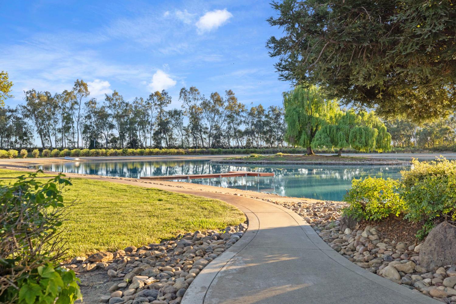 10675 Valensin Road Galt, CA 95632 - Photo 73 of 99 a view of a swimming pool with an outdoor seating and a yard