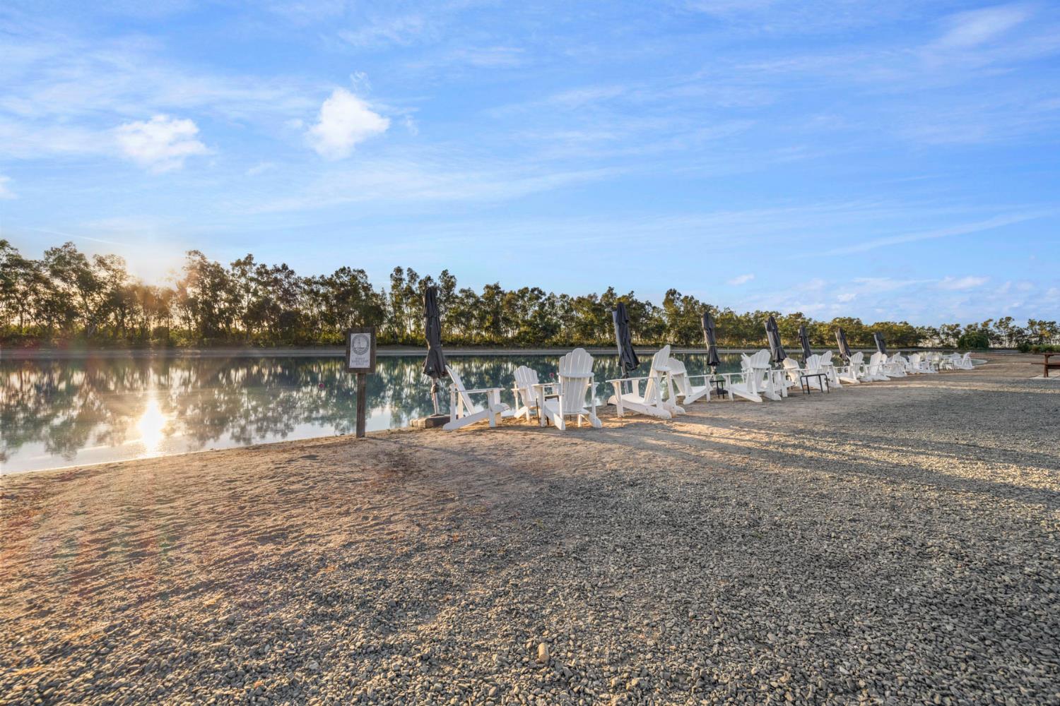 10675 Valensin Road Galt, CA 95632 - Photo 86 of 99 a view of a lake with houses in the back