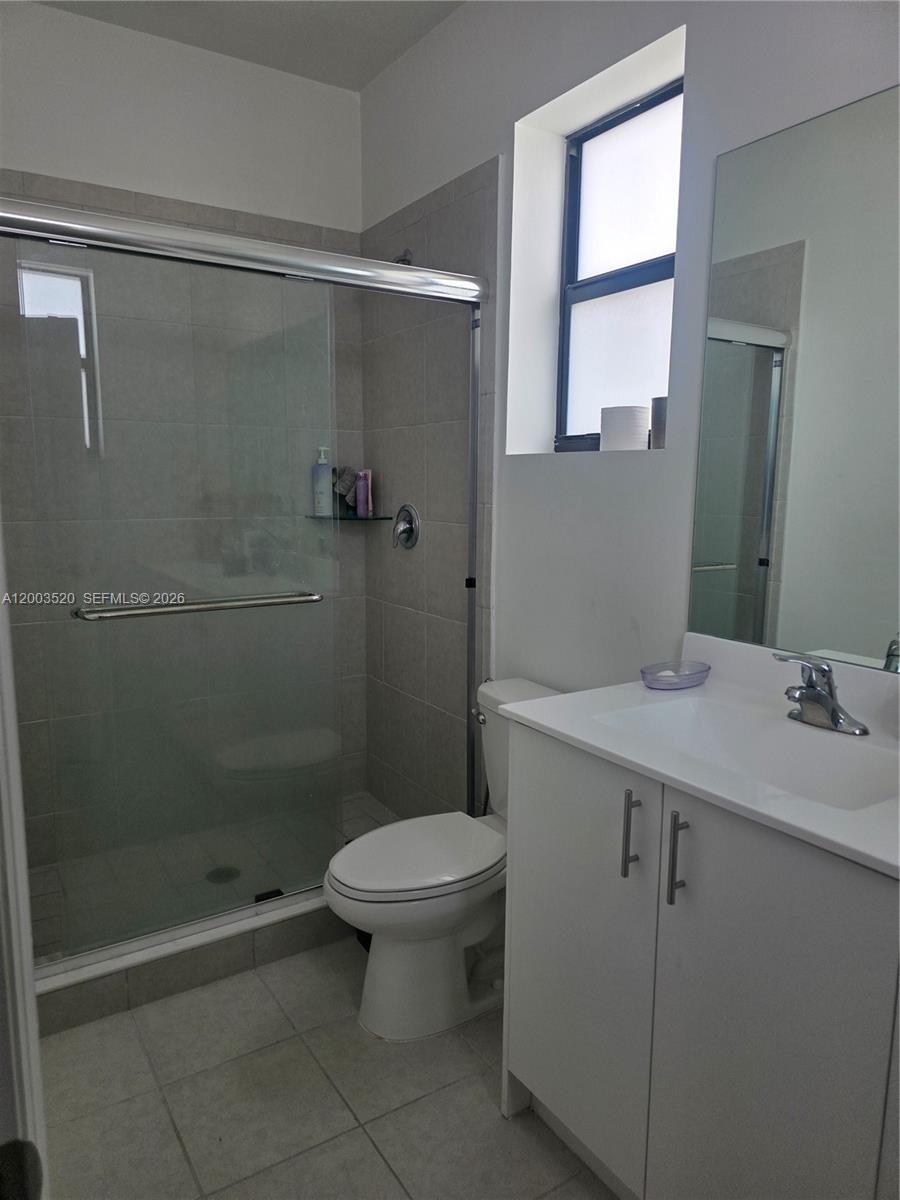 23231 Southwest 129th Path Homestead, FL 33032 - Photo 11 of 33 a bathroom with a sink a toilet and shower
