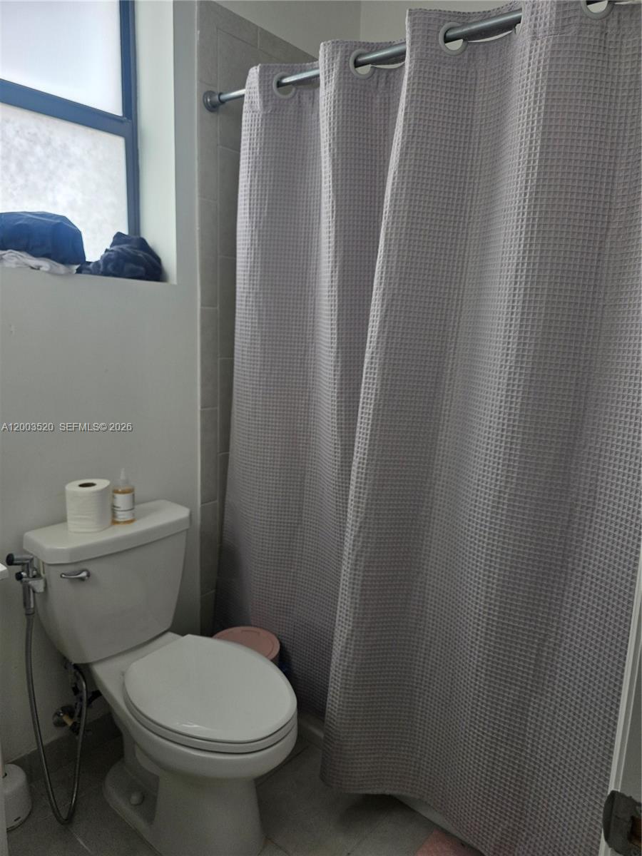 23231 Southwest 129th Path Homestead, FL 33032 - Photo 14 of 33 a bathroom with a sink and toilet