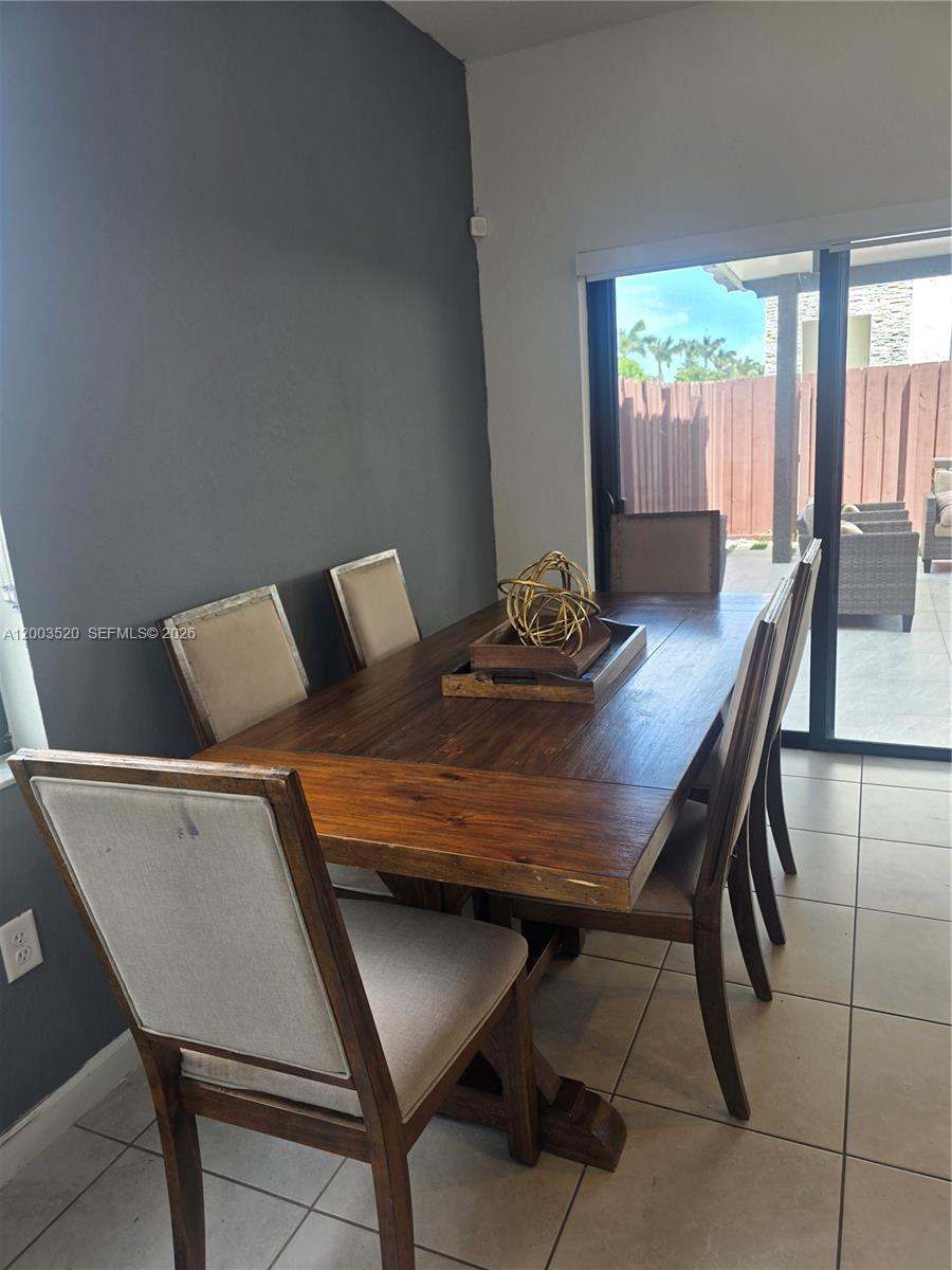 23231 Southwest 129th Path Homestead, FL 33032 - Photo 20 of 33 a view of a dining room with furniture and window