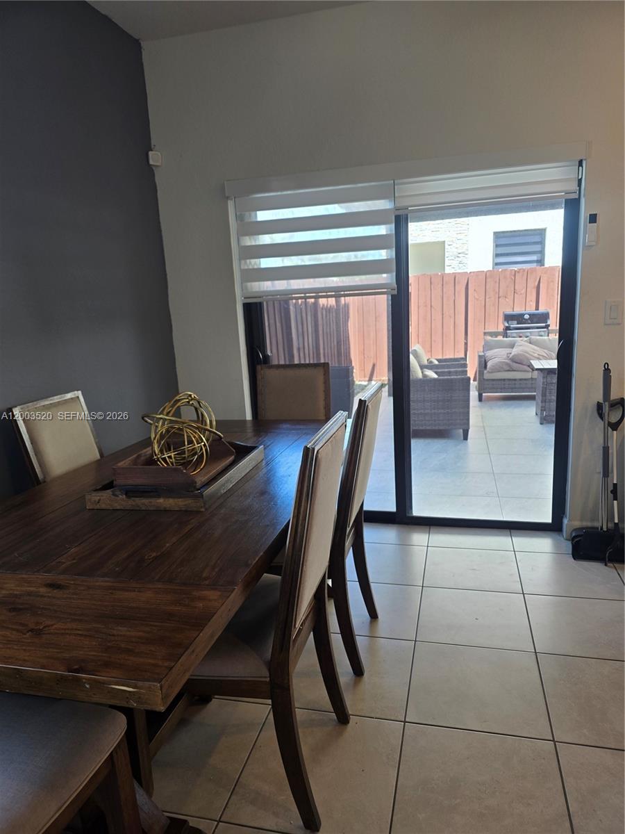 23231 Southwest 129th Path Homestead, FL 33032 - Photo 28 of 33 a view of a dining room with furniture window and outside view