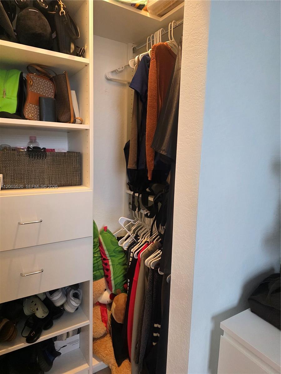 23231 Southwest 129th Path Homestead, FL 33032 - Photo 3 of 33 a view of walk in closet with clothes and shoes