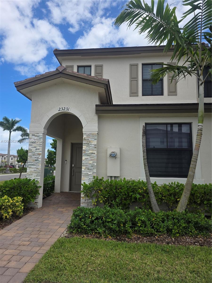 23231 Southwest 129th Path Homestead, FL 33032 - Photo 6 of 33 a front view of a house with garden