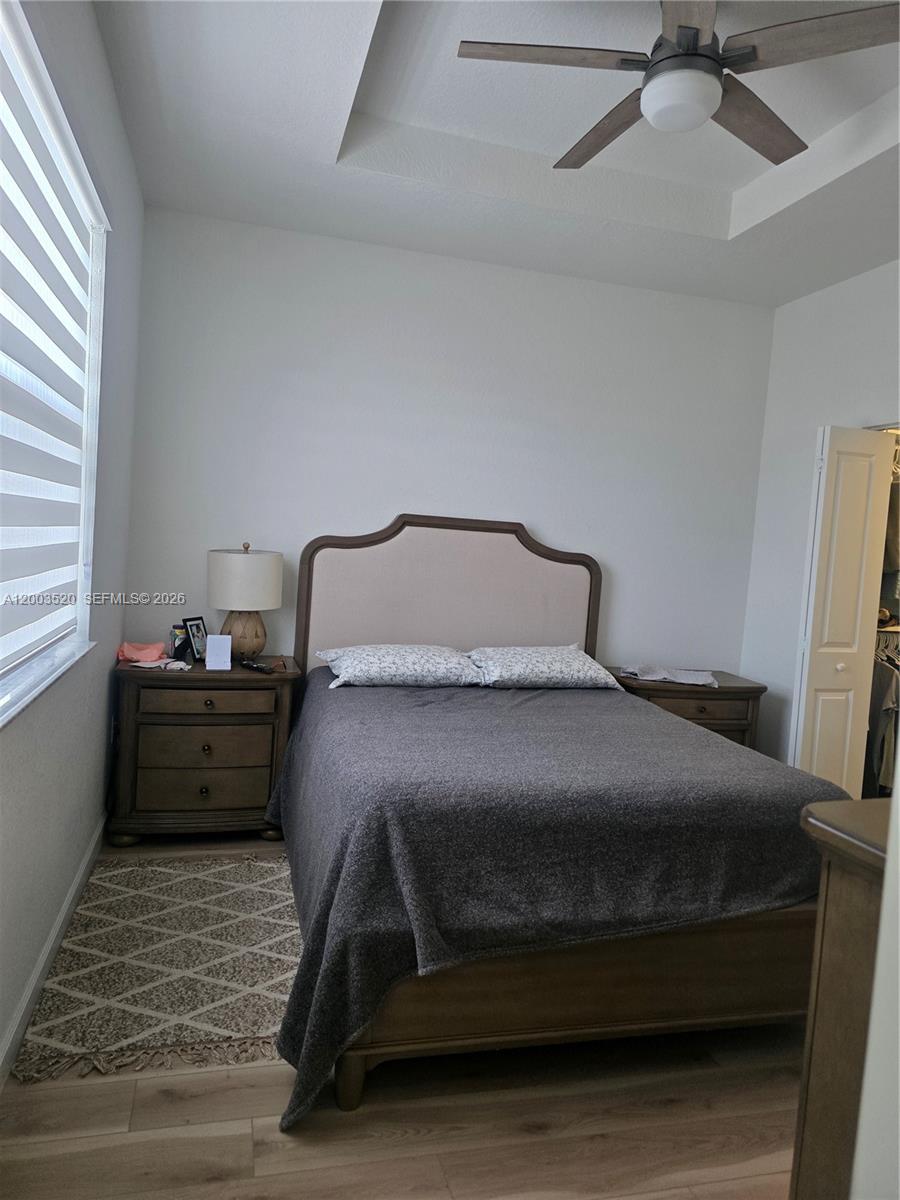 23231 Southwest 129th Path Homestead, FL 33032 - Photo 9 of 33 a bedroom with a bed and window