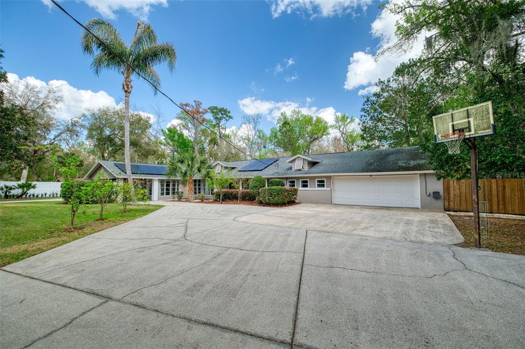182 Parsons Road Longwood, FL 32779 - Photo 1 of 54 a view of a yard with plants and a fountain