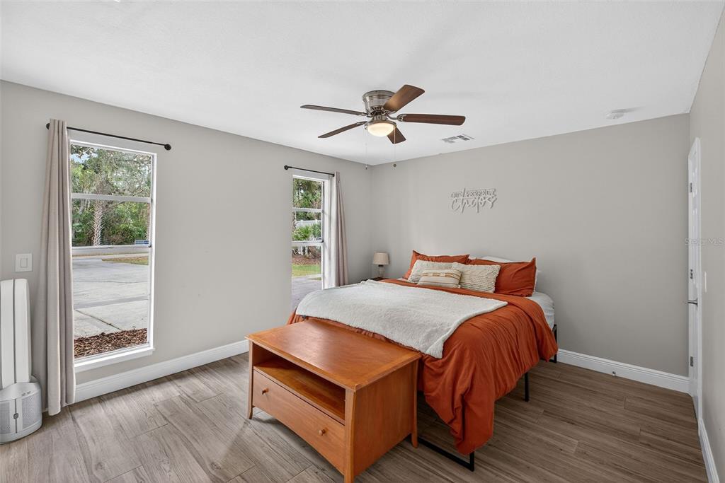 182 Parsons Road Longwood, FL 32779 - Photo 17 of 54 a bed sitting in a bedroom next to a window