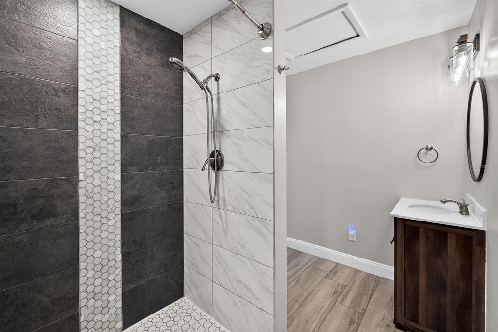 182 Parsons Road Longwood, FL 32779 - Photo 18 of 54 a bathroom with a sink and shower