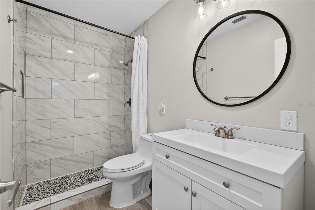 182 Parsons Road Longwood, FL 32779 - Photo 20 of 54 a bathroom with a sink a toilet and a mirror