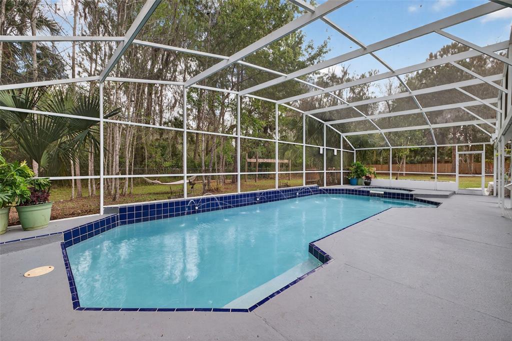 182 Parsons Road Longwood, FL 32779 - Photo 2 of 54 a view of a swimming pool with an outdoor space