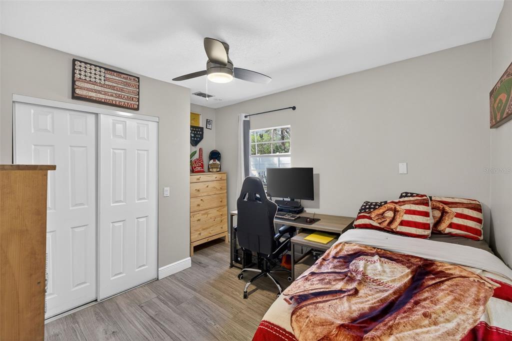 182 Parsons Road Longwood, FL 32779 - Photo 21 of 54 a bedroom with a bed and wooden floor