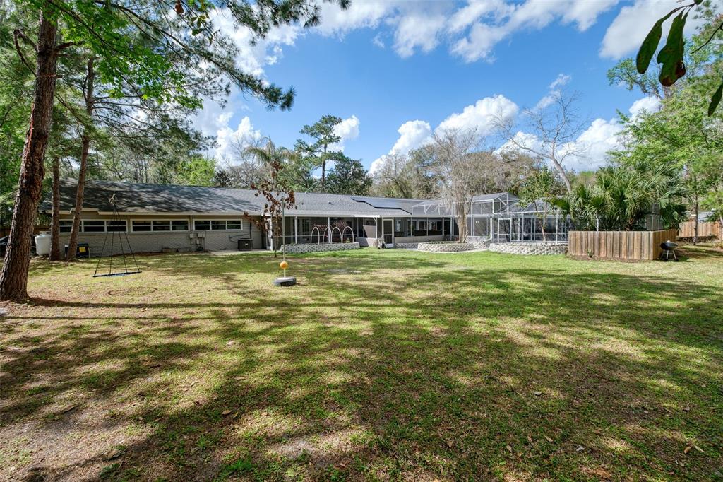 182 Parsons Road Longwood, FL 32779 - Photo 30 of 54 a view of a house with a yard