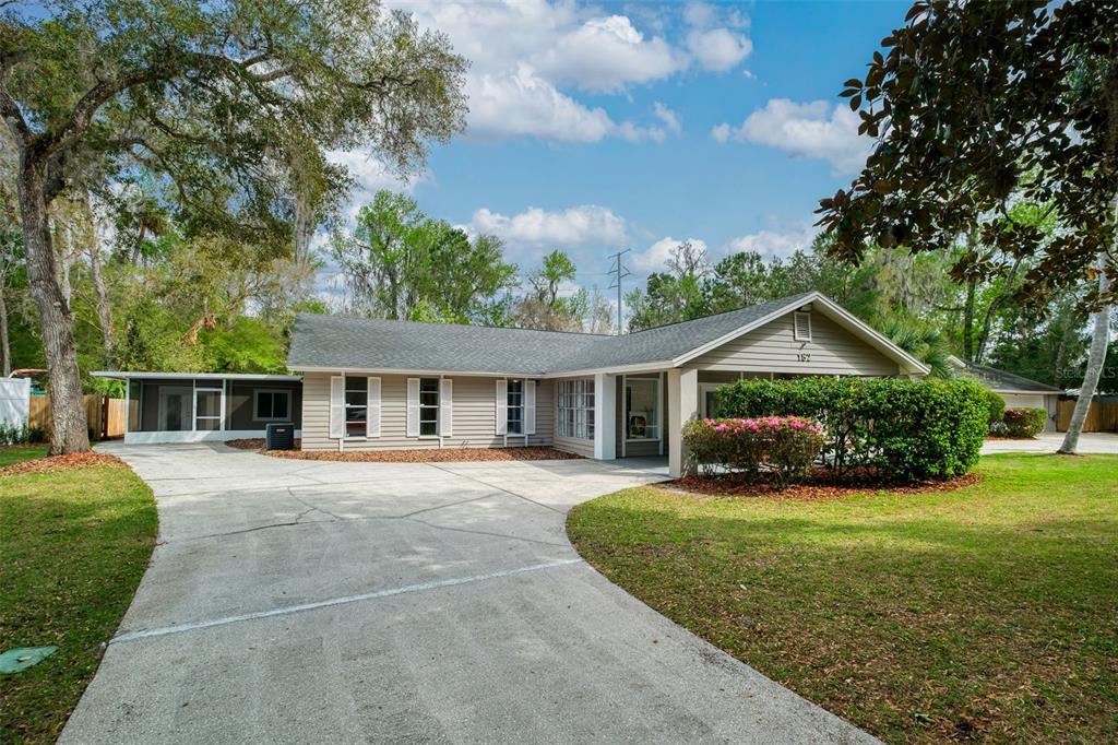 182 Parsons Road Longwood, FL 32779 - Photo 37 of 54 a front view of a house with yard and green space