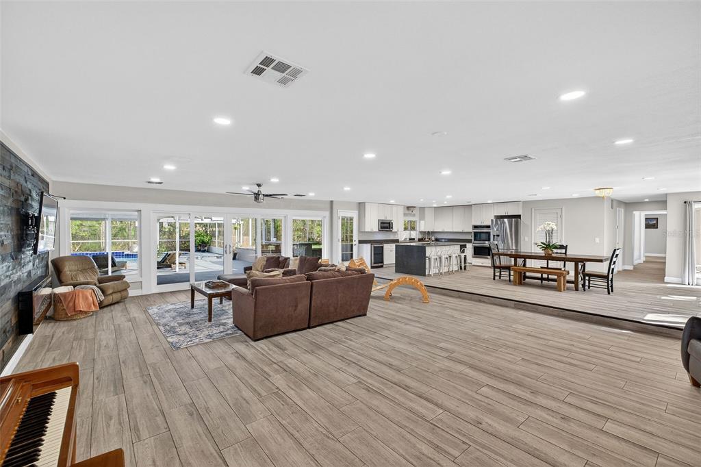 182 Parsons Road Longwood, FL 32779 - Photo 4 of 54 a living room with furniture and a wooden floor