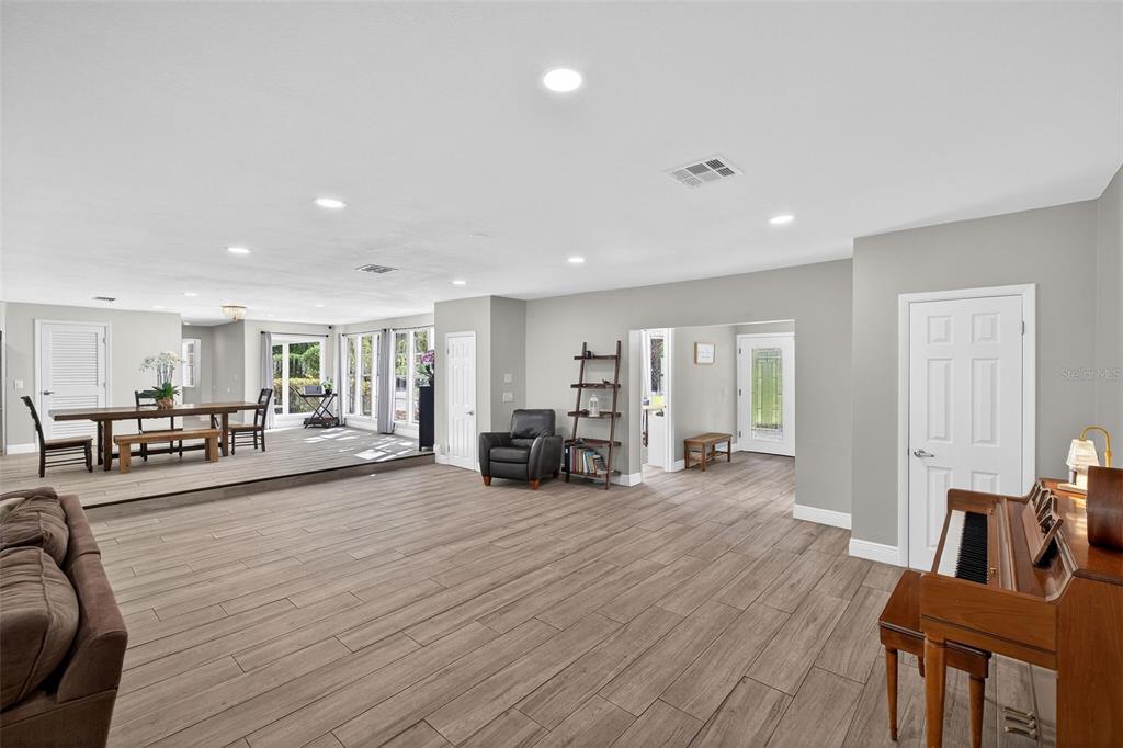 182 Parsons Road Longwood, FL 32779 - Photo 41 of 54 a living room with furniture and a wooden floor