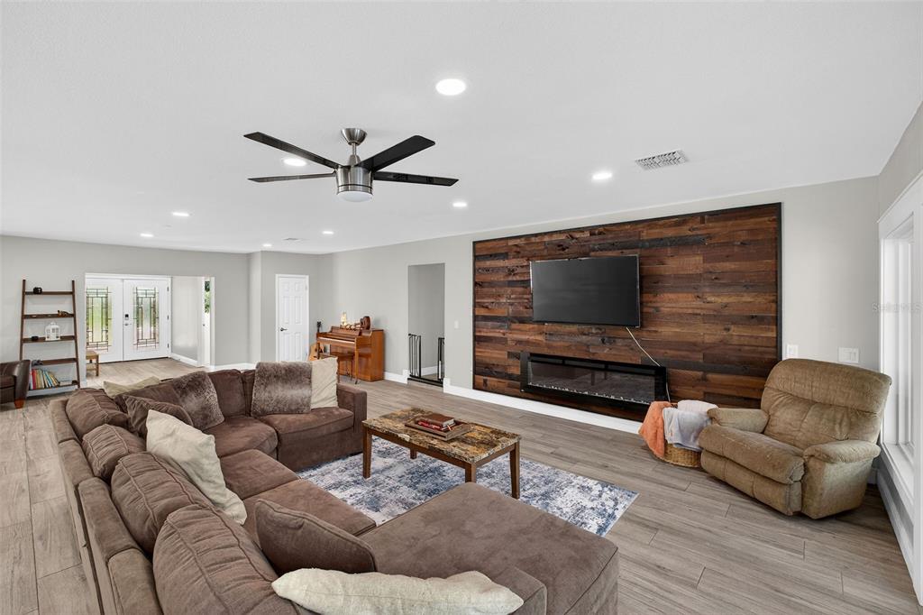 182 Parsons Road Longwood, FL 32779 - Photo 43 of 54 a living room with furniture and a flat screen tv