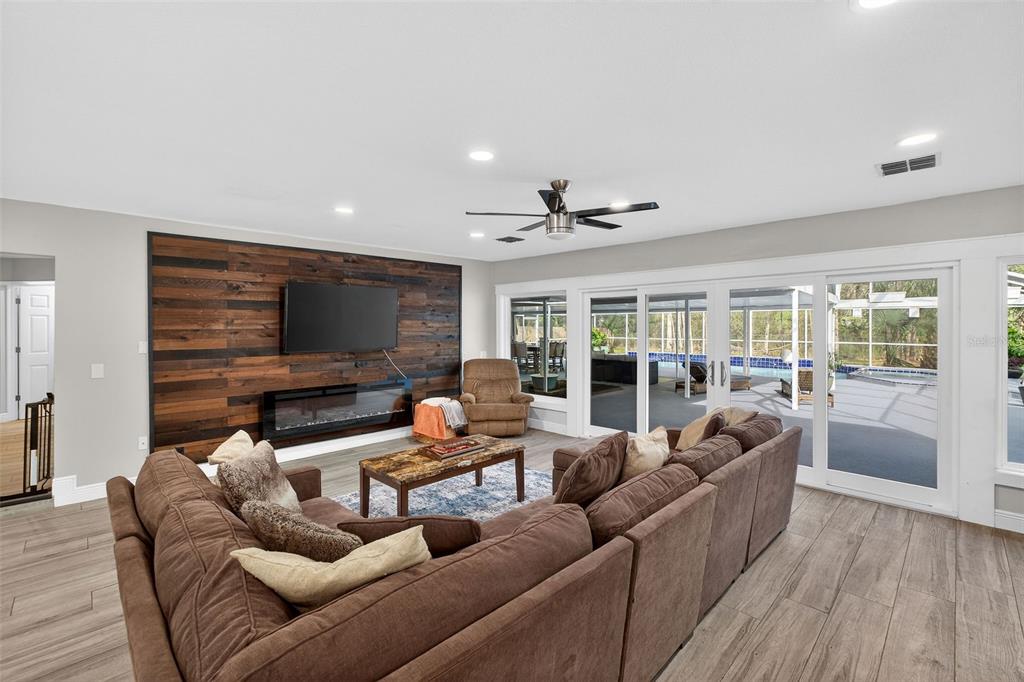 182 Parsons Road Longwood, FL 32779 - Photo 5 of 54 a living room with furniture and a flat screen tv