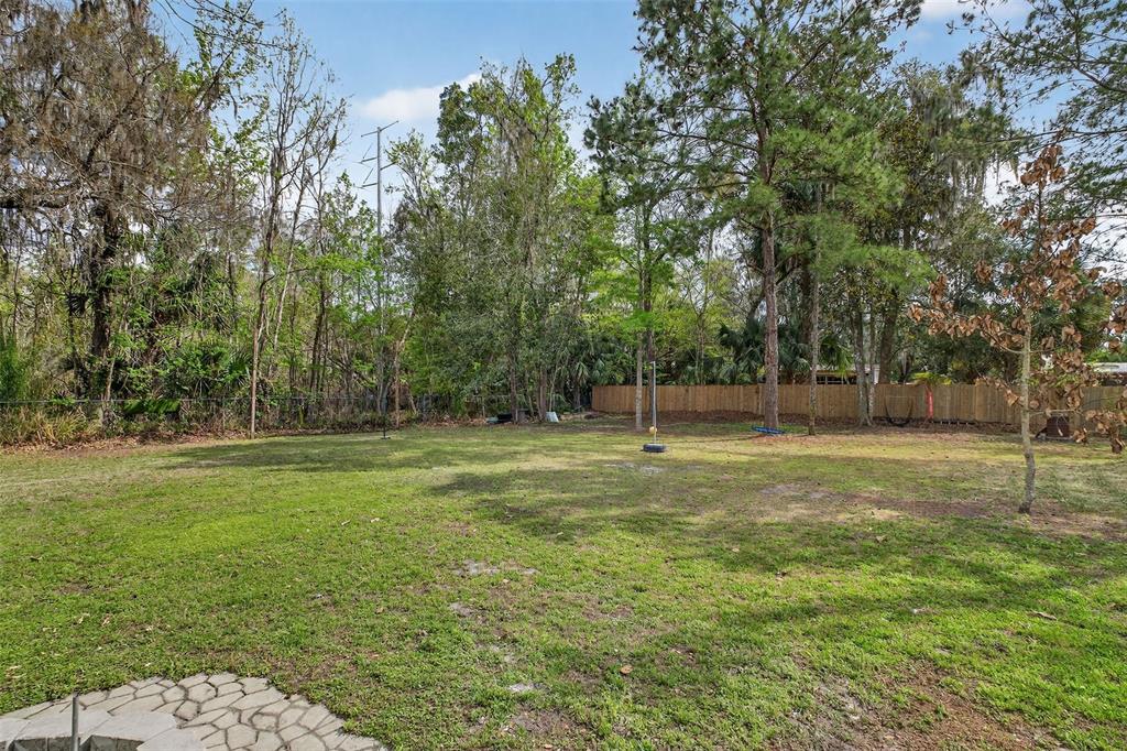 182 Parsons Road Longwood, FL 32779 - Photo 52 of 54 a view of outdoor space with deck and yard