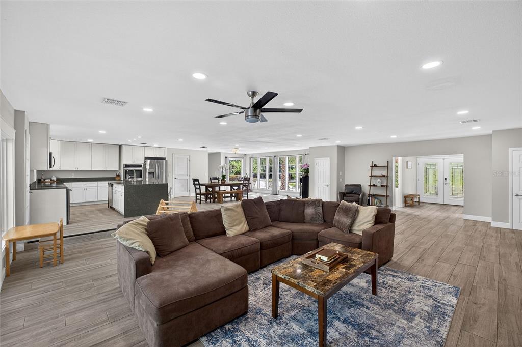 182 Parsons Road Longwood, FL 32779 - Photo 6 of 54 a living room with furniture and kitchen view