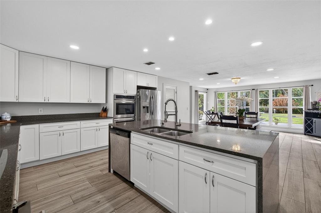 182 Parsons Road Longwood, FL 32779 - Photo 9 of 54 a kitchen with sink stove top oven and refrigerator