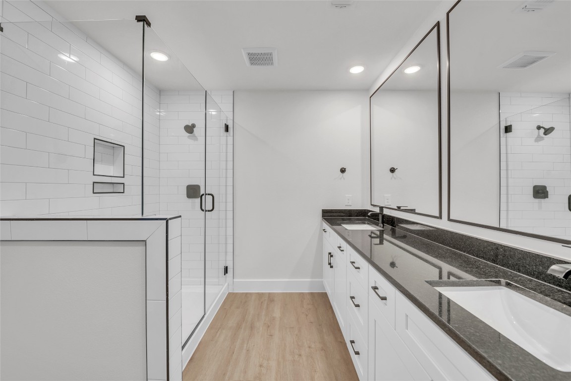 9317 Curious Squirrel Street Austin, TX 78744 - Photo 11 of 26 a large kitchen with a sink and refrigerator