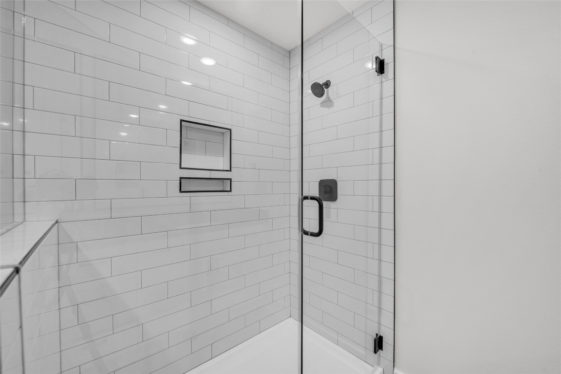 9317 Curious Squirrel Street Austin, TX 78744 - Photo 12 of 26 a bathroom with a shower