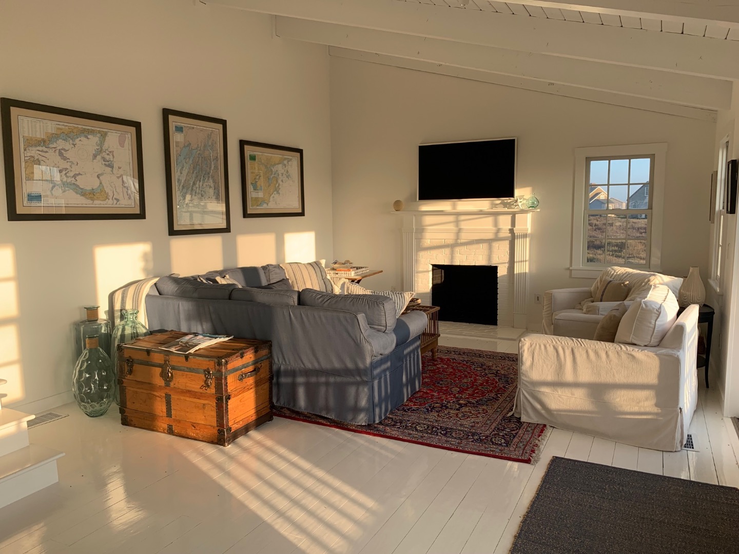 22 Sheep Pond Road Nantucket, MA 02554 - Photo 14 of 27 a living room with furniture and a flat screen tv