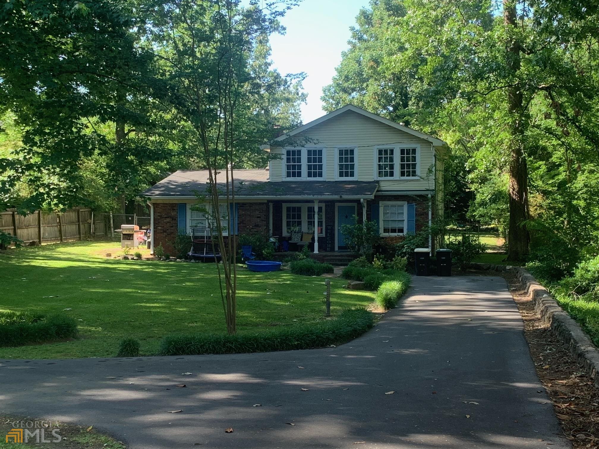 107 Charlton Street Northwest Rome, GA 30165 - Photo 1 of 1 a front view of a house with a yard