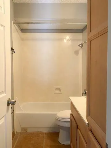 a bathroom with a toilet and a bathtub