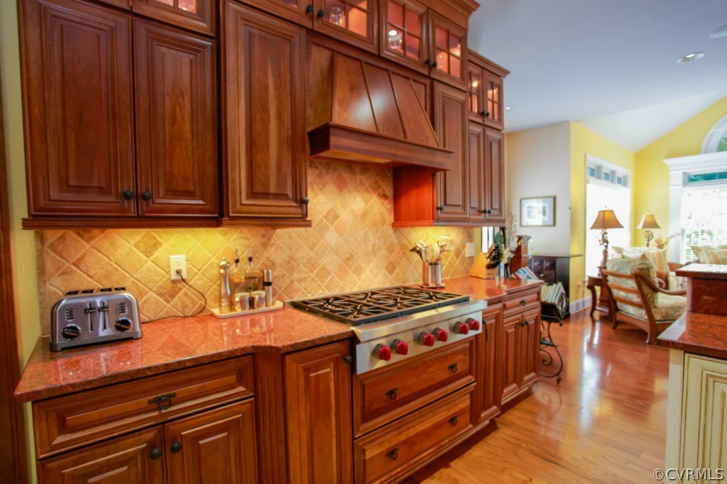 3700 Bircham Loop Midlothian, VA 23113 - Photo 7 of 24 a kitchen with stainless steel appliances granite countertop a stove and a wooden cabinets
