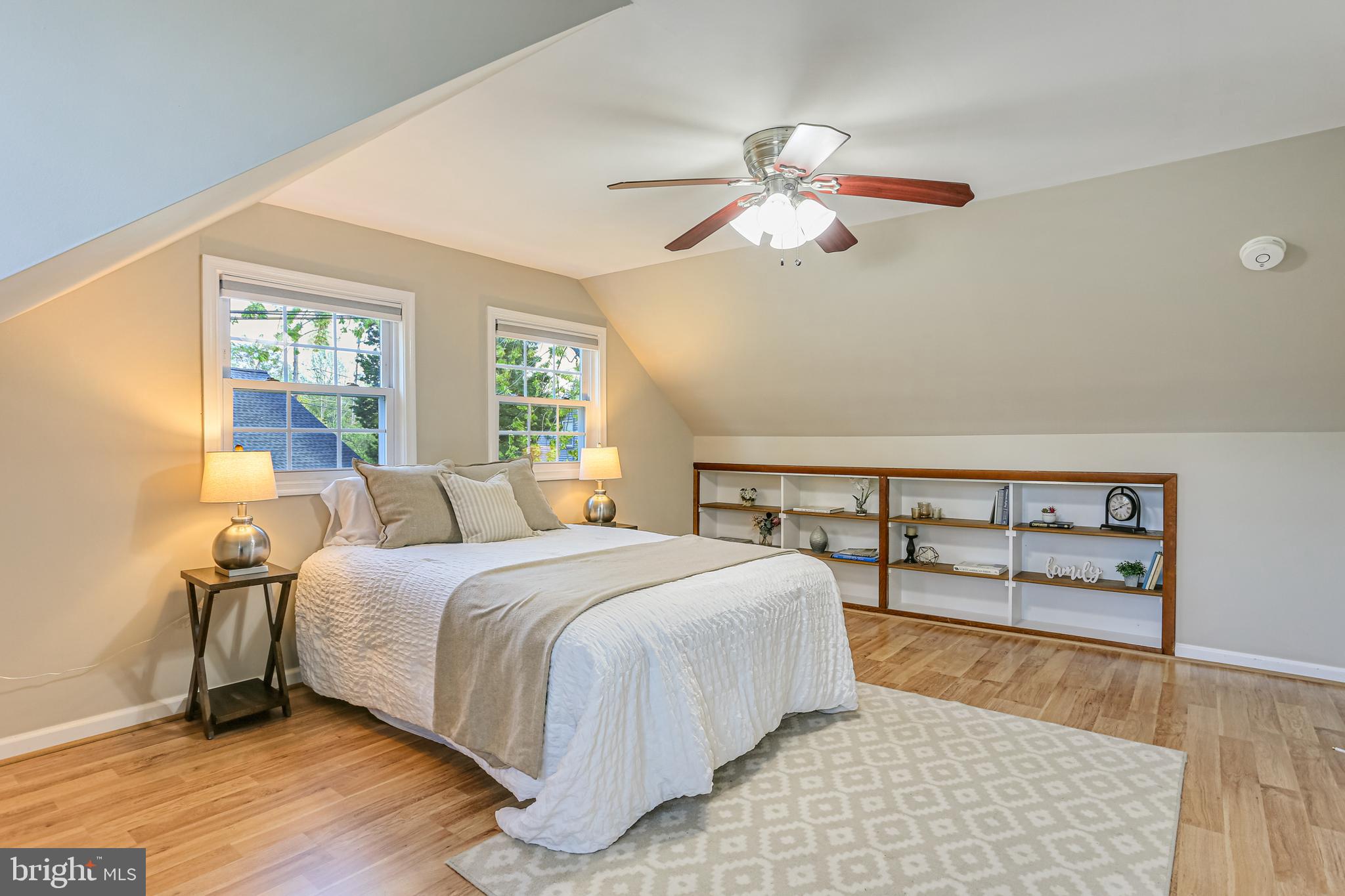 9939 Cottrell Terrace Silver Spring, MD 20903 - Photo 12 of 33 a bedroom with a bed and a dresser