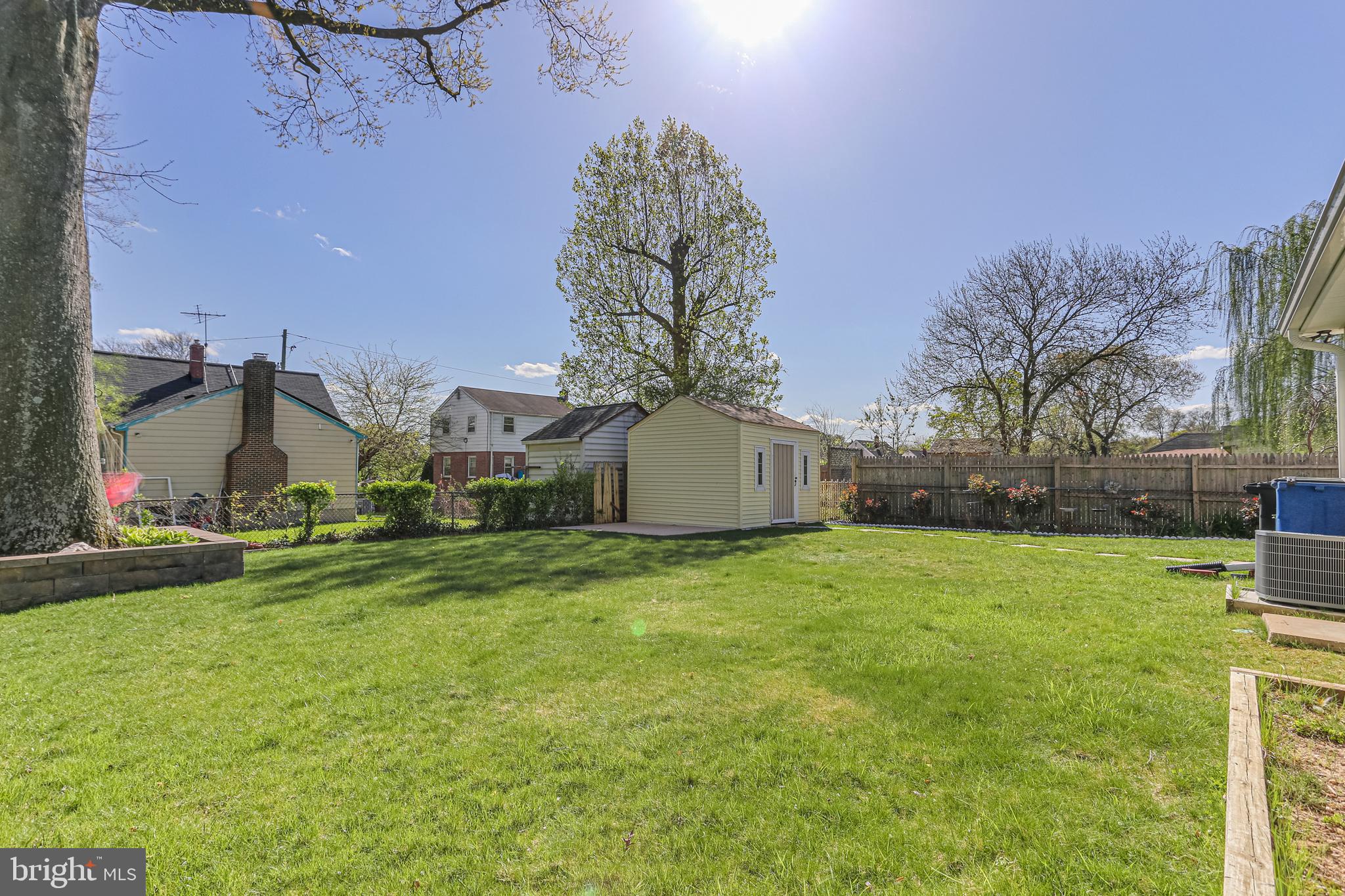 9939 Cottrell Terrace Silver Spring, MD 20903 - Photo 27 of 33 a view of a big room with a big yard and large trees