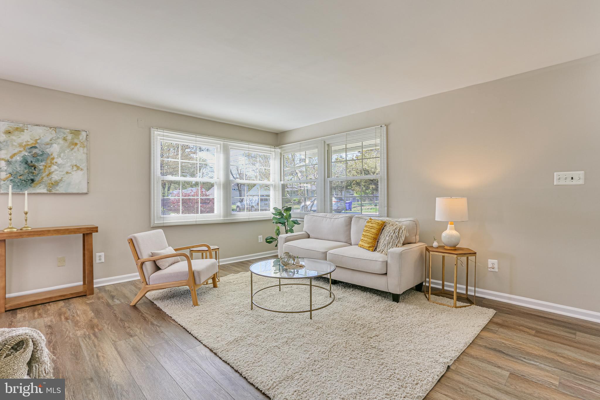 9939 Cottrell Terrace Silver Spring, MD 20903 - Photo 3 of 33 a living room with furniture and a large window