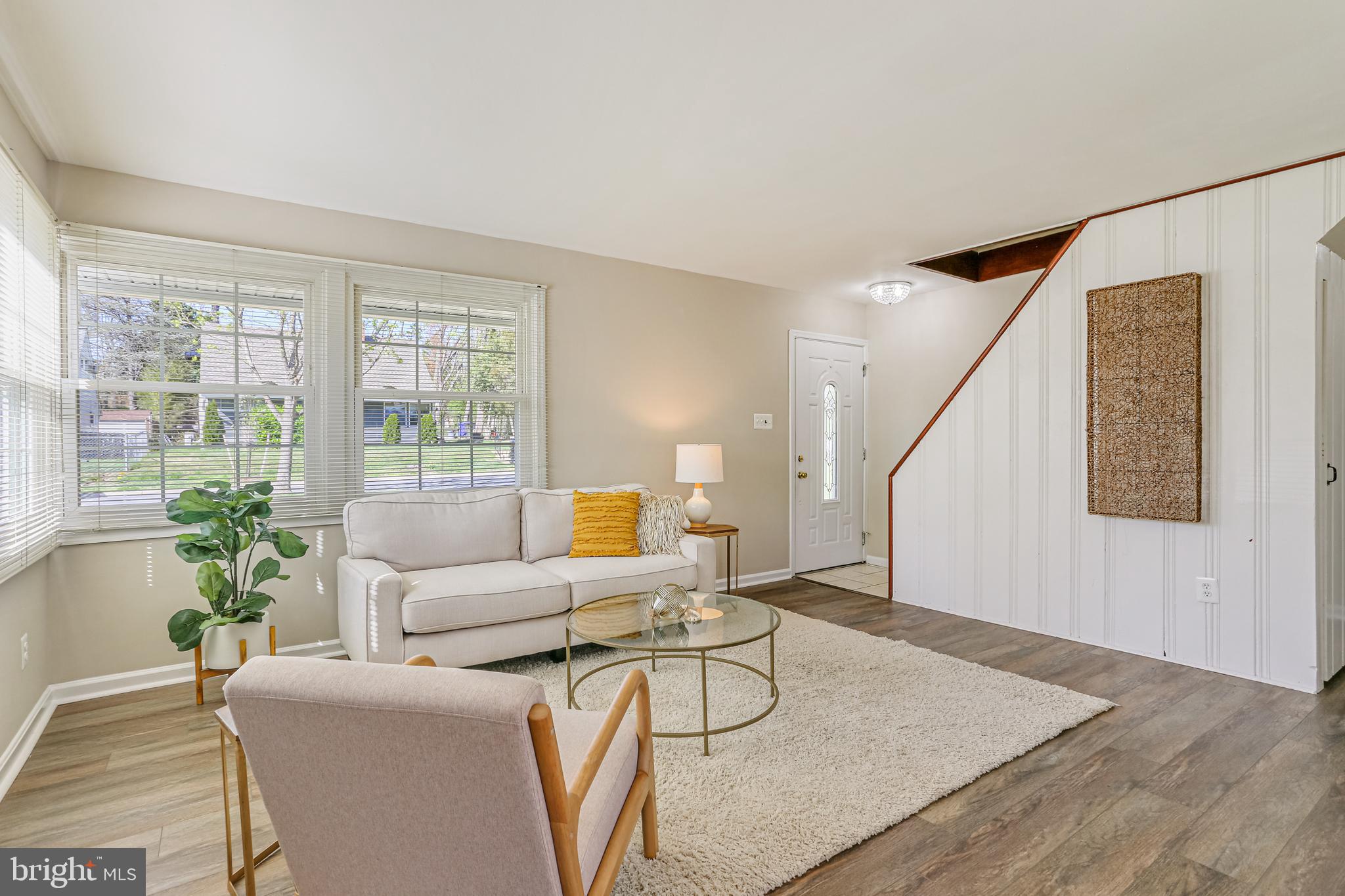 9939 Cottrell Terrace Silver Spring, MD 20903 - Photo 5 of 33 a living room with furniture and wooden floor