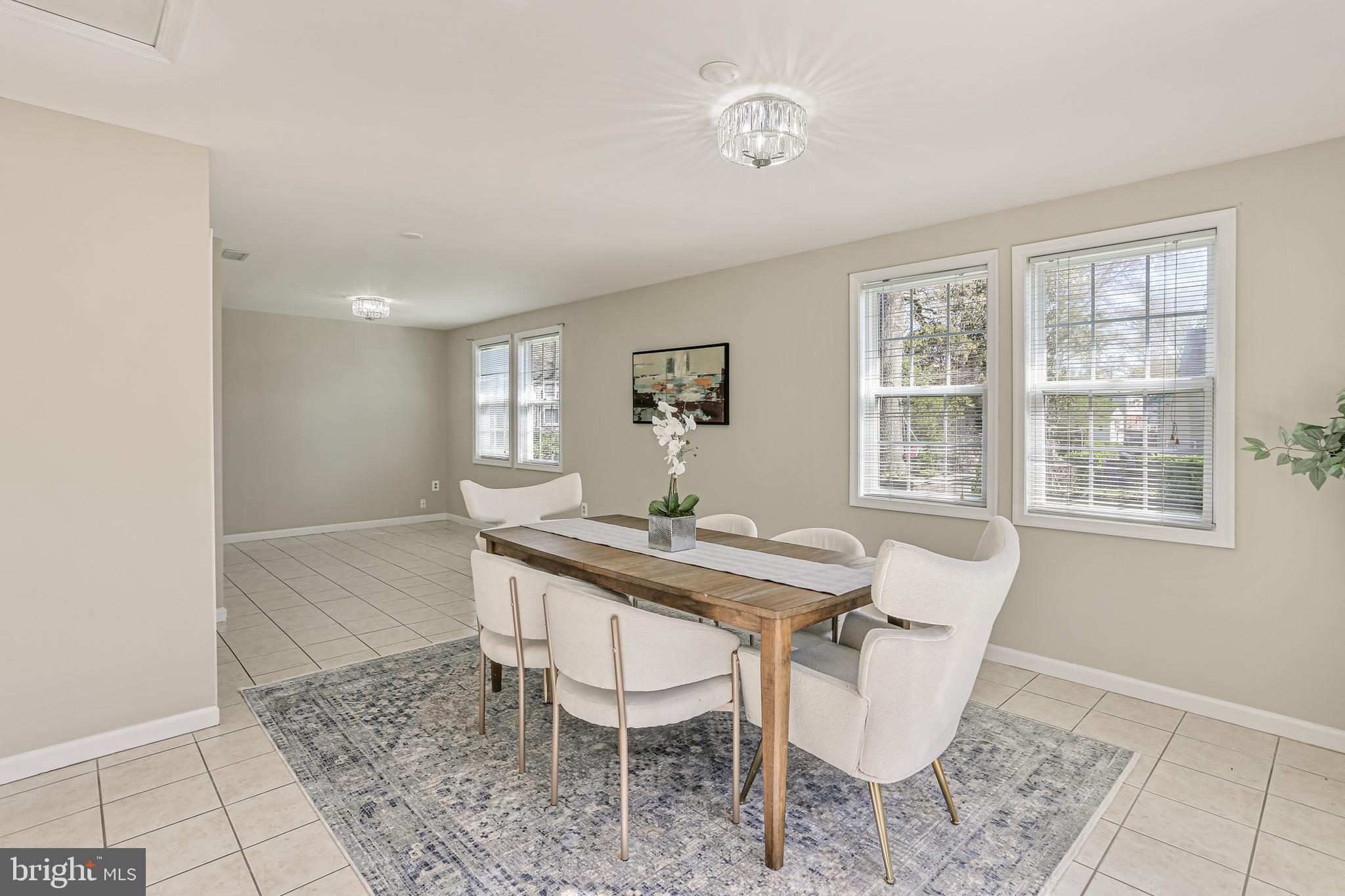 9939 Cottrell Terrace Silver Spring, MD 20903 - Photo 9 of 33 a dining room with furniture and window