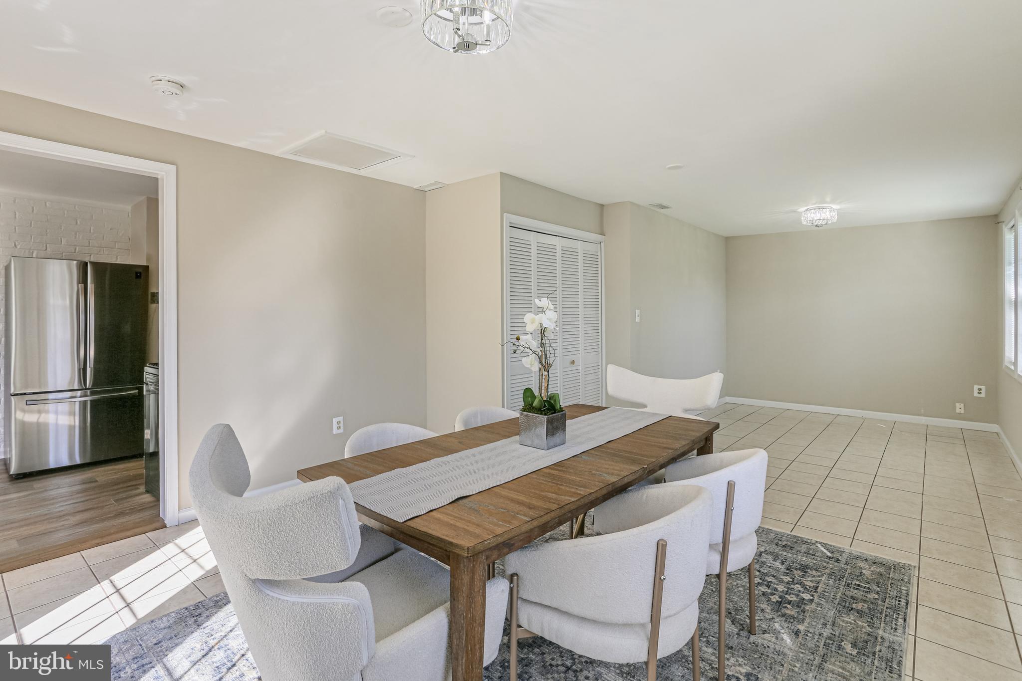 9939 Cottrell Terrace Silver Spring, MD 20903 - Photo 10 of 33 a view of a dining room with furniture and wooden floor