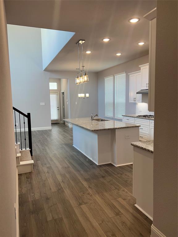 3610 Pacific Way Sachse, TX 75048 - Photo 4 of 23 a view of kitchen with kitchen island microwave and sink