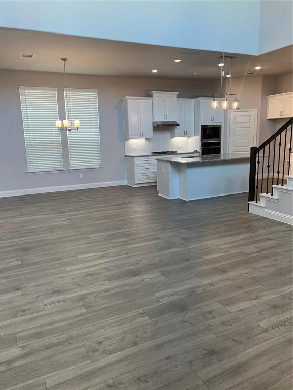 3610 Pacific Way Sachse, TX 75048 - Photo 7 of 23 a view of kitchen with wooden floor and electronic appliances