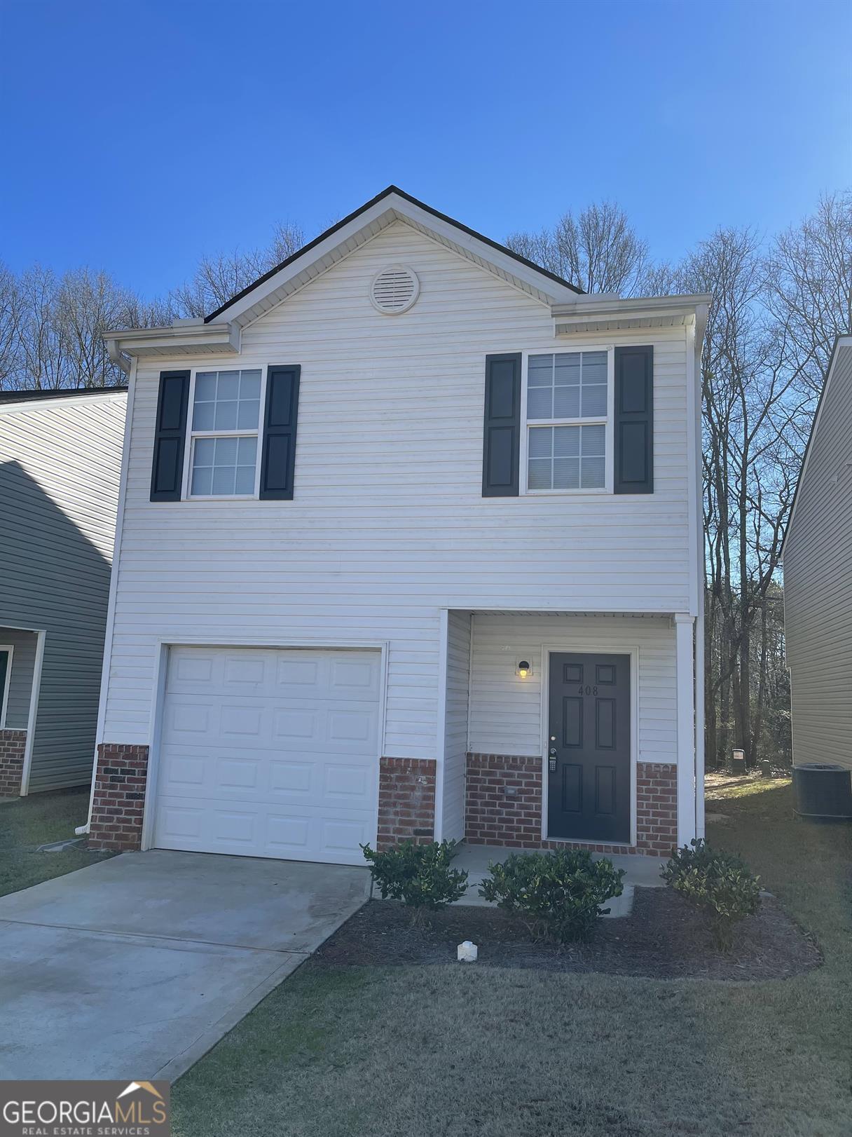 408 Erin Court Villa Rica, GA 30180 - Photo 1 of 16 a front view of a house with a yard and garage